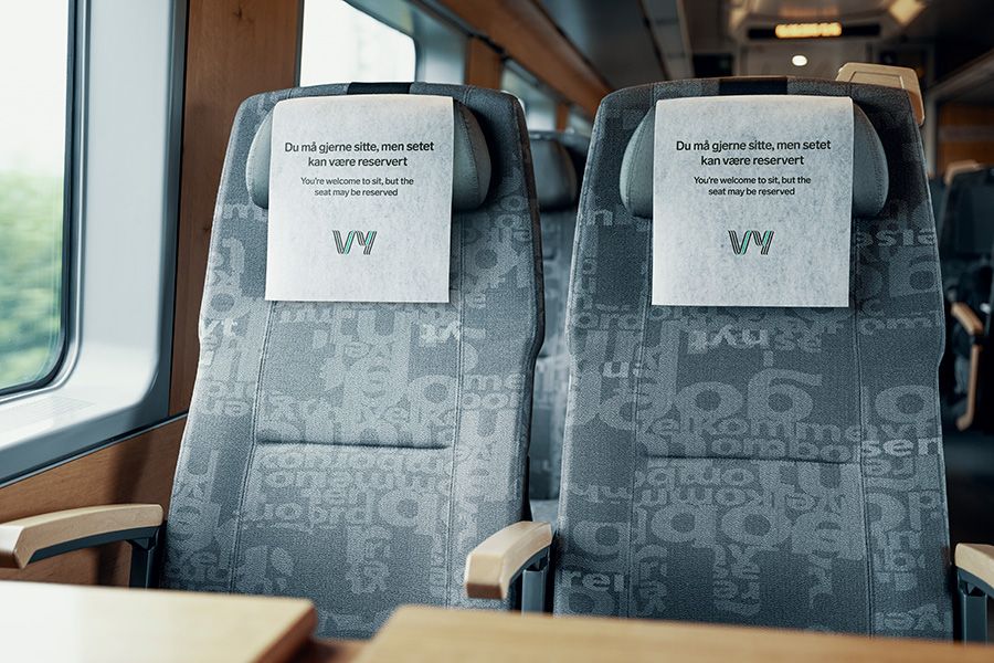 Train seats with information on the head rest that the seats may be reserved