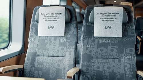 Train seats with information on the head rest that the seats may be reserved