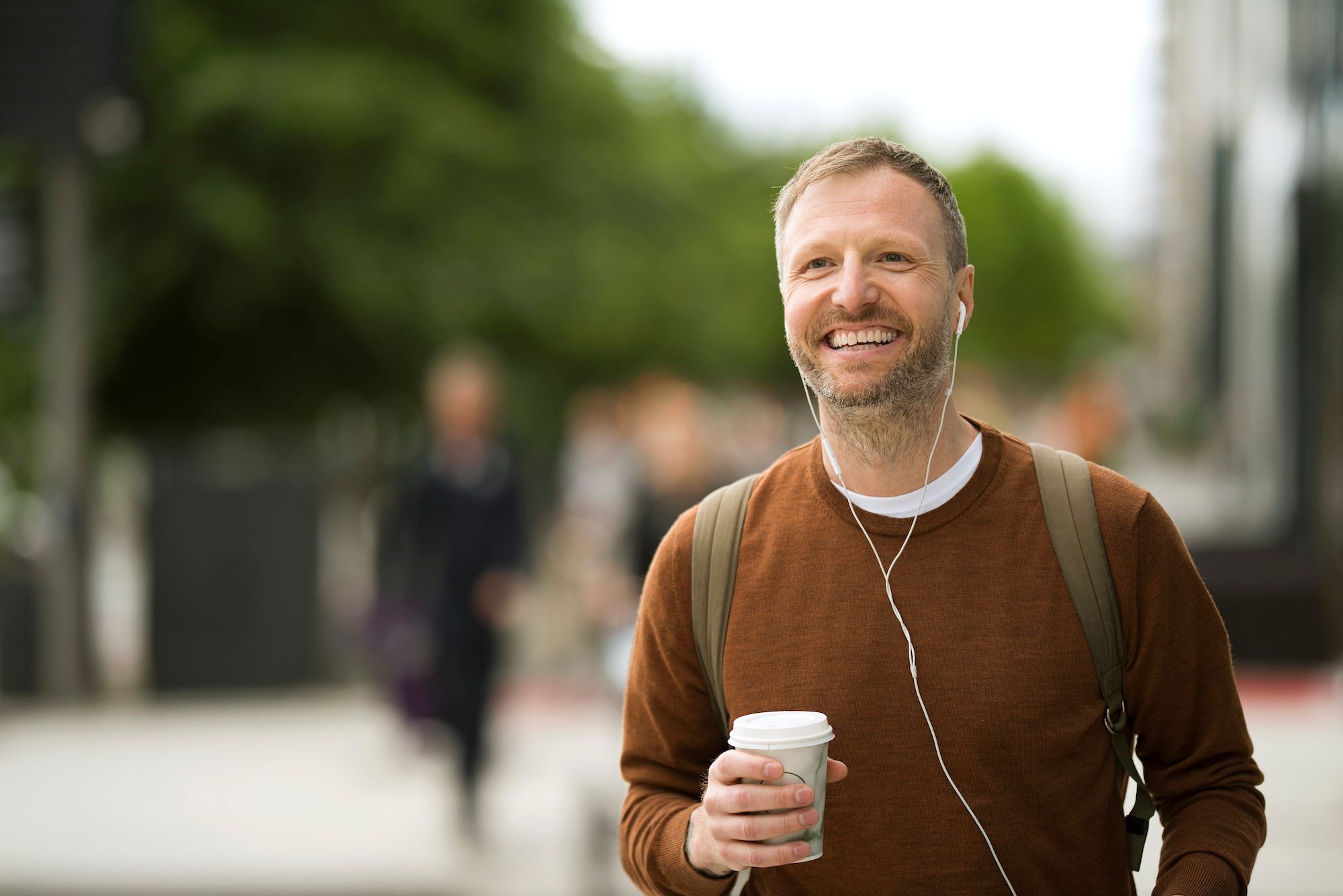 Man holding a coffee cup.