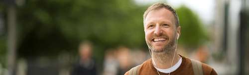 Man holding a coffee cup.