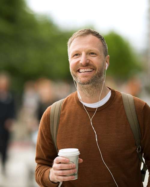 Man holding a coffee cup.